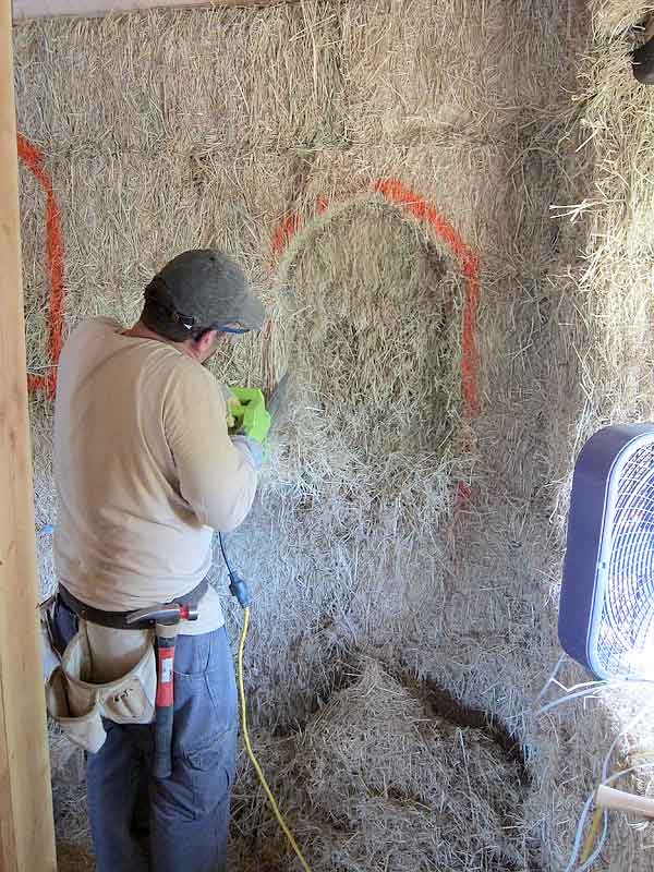 Cutting a window in a straw bale house
